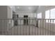 Bright white kitchen with stainless steel appliances and ample cabinet space at 627 W Mendoza Ave, Mesa, AZ 85210
