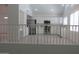 Well-equipped kitchen with stainless steel appliances, white cabinets, and a functional layout at 627 W Mendoza Ave, Mesa, AZ 85210