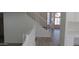 Entry area with staircase leading to upstairs and view to front entry at 627 W Mendoza Ave, Mesa, AZ 85210