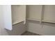 Spacious walk-in closet featuring custom shelving and ample storage space for organization at 627 W Mendoza Ave, Mesa, AZ 85210