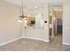 Dining area with tile floors, modern lighting, and a view to the kitchen at 6436 W Saddlehorn Rd, Phoenix, AZ 85083