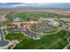Stunning aerial view of a golf course, country club, and surrounding community with lush landscaping at 70 E Kennedia Dr, Queen Creek, AZ 85140