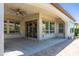Large covered patio with ceiling fan and sliding glass doors offers seamless indoor/outdoor living at 70 E Kennedia Dr, Queen Creek, AZ 85140