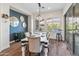 Elegant dining room with modern lighting, stylish decor, and a sliding glass door at 70 E Kennedia Dr, Queen Creek, AZ 85140