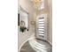 Bright entryway featuring tiled floors, an ornate chandelier, a niche, and a glass-paneled front door at 70 E Kennedia Dr, Queen Creek, AZ 85140