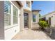 Charming single-story home entrance with a modern-designed door and well-maintained landscaping at 70 E Kennedia Dr, Queen Creek, AZ 85140