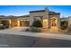 Inviting single-story home featuring a neat front yard, a two-car garage, and an arched entryway at 70 E Kennedia Dr, Queen Creek, AZ 85140