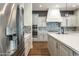 Modern kitchen boasting stainless steel appliances, sleek countertops, designer backsplash, and stylish lighting at 70 E Kennedia Dr, Queen Creek, AZ 85140