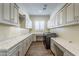 Well-organized laundry room with abundant cabinetry, stylish countertops, and modern washer and dryer at 70 E Kennedia Dr, Queen Creek, AZ 85140