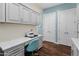 Spacious laundry room/office combo with built-in desk, ample storage and modern finishes at 70 E Kennedia Dr, Queen Creek, AZ 85140
