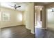 Open-concept living area featuring wood-look tile, a decorative niche, and bright natural light at 70 E Kennedia Dr, Queen Creek, AZ 85140