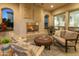 Cozy outdoor fireplace surrounded by comfortable seating, perfect for evening relaxation at 70 E Kennedia Dr, Queen Creek, AZ 85140