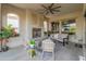 Inviting outdoor living space with fireplace, comfortable seating, and stylish decor at 70 E Kennedia Dr, Queen Creek, AZ 85140