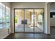 Covered patio featuring an outdoor fireplace and ceiling fan at 70 E Kennedia Dr, Queen Creek, AZ 85140