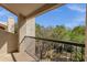 Balcony overlooks mature trees and landscaping with a blue sky overhead at 7101 W Beardsley Rd # 1502, Glendale, AZ 85308