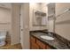 Bathroom featuring a granite countertop, vanity, mirror and a toilet at 7101 W Beardsley Rd # 1502, Glendale, AZ 85308