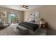 Bedroom featuring neutral decor, a padded headboard, and a balcony at 7101 W Beardsley Rd # 1502, Glendale, AZ 85308