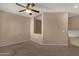 Carpeted bedroom with ceiling fan, showing an open wall design at 7101 W Beardsley Rd # 1502, Glendale, AZ 85308