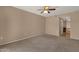 Spacious carpeted bedroom showing view to the bathroom and balcony at 7101 W Beardsley Rd # 1502, Glendale, AZ 85308