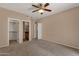 Spacious bedroom with a ceiling fan and multiple entry points at 7101 W Beardsley Rd # 1502, Glendale, AZ 85308