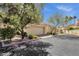 Charming townhome featuring a private two-car garage and lush landscaping with mature trees at 7101 W Beardsley Rd # 1502, Glendale, AZ 85308