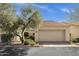 Charming single-Gathering home featuring a two-car garage, beautiful tile roof, and inviting desert landscaping at 7101 W Beardsley Rd # 1502, Glendale, AZ 85308