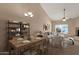Inviting living and dining area with vaulted ceiling, comfortable seating, and stylish decor for Gathering gatherings at 7101 W Beardsley Rd # 1502, Glendale, AZ 85308