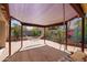 Charming backyard features a shaded pergola with a hammock and swing, plus a lush garden mural at 725 W Beth Dr, Phoenix, AZ 85041