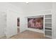 Bright bedroom featuring built-in shelving and mirrored closet doors for an open and spacious feel at 725 W Beth Dr, Phoenix, AZ 85041