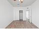 Clean and bright bedroom features wood-look floors, a ceiling fan, and a closet at 725 W Beth Dr, Phoenix, AZ 85041