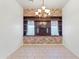 Bright dining room showcasing custom built-ins with accent lighting and tile floors at 725 W Beth Dr, Phoenix, AZ 85041
