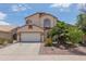 Charming two-story home featuring a spacious two-car garage and well-manicured landscaping at 725 W Beth Dr, Phoenix, AZ 85041