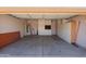Spacious garage interior featuring ample cabinet storage, an automatic door, and a utility sink at 725 W Beth Dr, Phoenix, AZ 85041