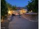 Backyard haven showcasing stone details, cozy fire pit, and bar area, perfect for outdoor living at 816 W Sycamore Ct, Litchfield Park, AZ 85340