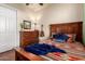 Comfortable bedroom featuring hardwood floors, soft lighting, and a warm color palette at 816 W Sycamore Ct, Litchfield Park, AZ 85340