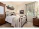 Sunlit bedroom with neutral tones, stylish furniture, and soothing decor at 816 W Sycamore Ct, Litchfield Park, AZ 85340