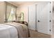 Well-lit bedroom featuring closet space and calming décor at 816 W Sycamore Ct, Litchfield Park, AZ 85340