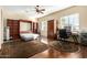 Bright bonus room featuring a wall bed, large wardrobe and desk space at 816 W Sycamore Ct, Litchfield Park, AZ 85340