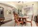 Elegant dining area featuring a round table, hardwood floors, and decorative arched entryway at 816 W Sycamore Ct, Litchfield Park, AZ 85340