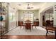 Bright dining room with hardwood floors, elegant furniture, and natural light streaming through the windows at 816 W Sycamore Ct, Litchfield Park, AZ 85340