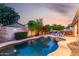 Inviting backyard pool and seating area with patio, ideal for outdoor relaxation at 816 W Sycamore Ct, Litchfield Park, AZ 85340