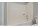 Bright bathroom showcasing a tub and shower combination with white tile surround at 818 S Westwood -- # 101, Mesa, AZ 85210