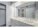 Bright bathroom featuring a double sink vanity, framed mirror, and plenty of cabinet storage at 818 S Westwood -- # 101, Mesa, AZ 85210
