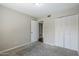 Bedroom with neutral carpet, and a closet, creating a serene retreat at 818 S Westwood -- # 101, Mesa, AZ 85210