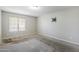 Bedroom featuring a mounted TV bracket and a window that provides natural lighting at 818 S Westwood -- # 101, Mesa, AZ 85210
