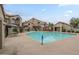 Inviting community pool area with ample seating and shade for residents to enjoy the outdoors at 818 S Westwood -- # 101, Mesa, AZ 85210