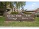 Community sign, Fiesta Park Village, offering well-maintained units in a convenient location at 818 S Westwood -- # 101, Mesa, AZ 85210