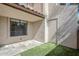 Spacious townhome front patio features stone pavers, green turf, exterior storage and ample natural light at 818 S Westwood -- # 101, Mesa, AZ 85210