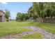 Expansive green space with mature trees and rock drainage area for a tranquil, well-maintained community aesthetic at 818 S Westwood -- # 101, Mesa, AZ 85210