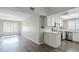 Bright kitchen featuring white cabinets, stainless steel appliances, and durable wood-look flooring at 818 S Westwood -- # 101, Mesa, AZ 85210